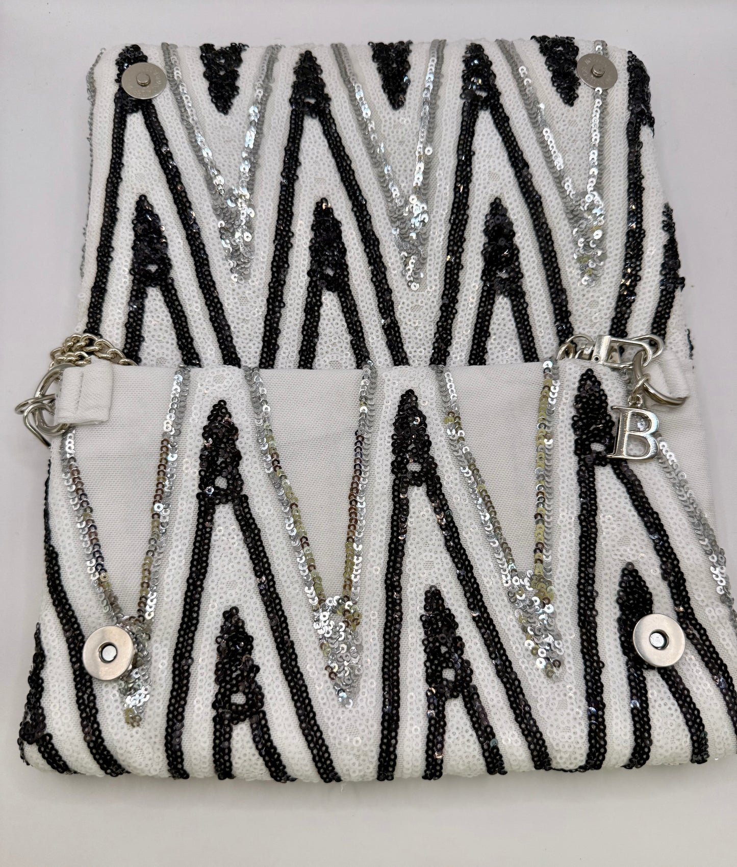 Zippy paillettes bianche nere e argento