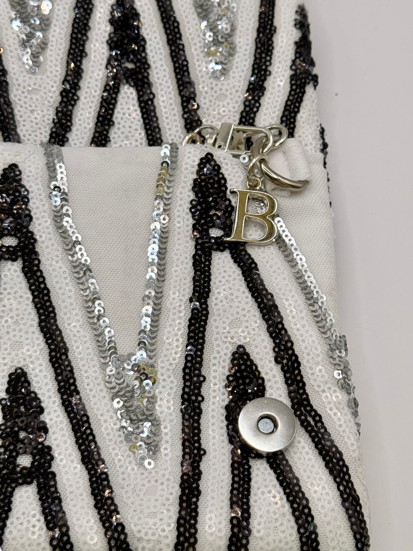 Zippy paillettes bianche nere e argento