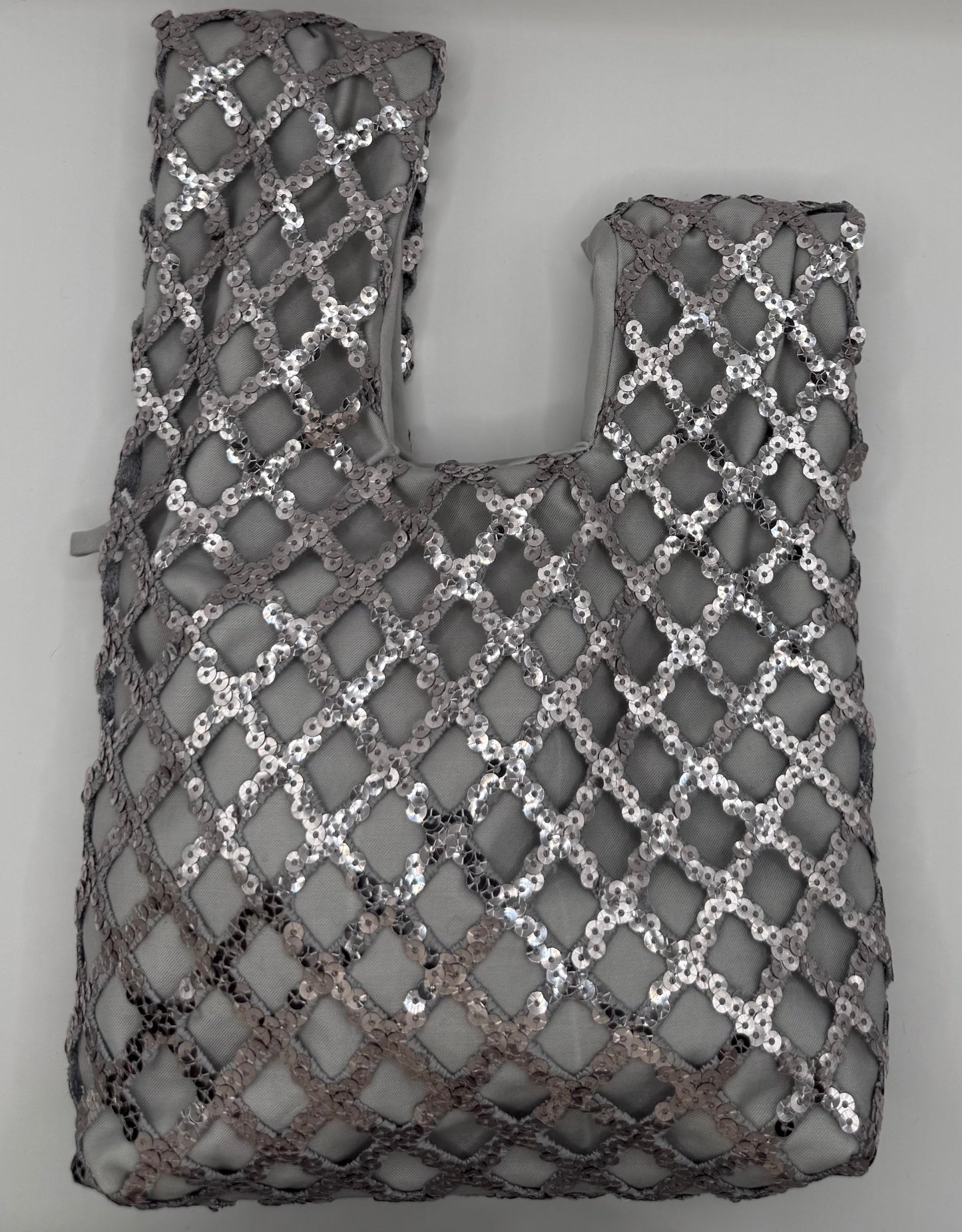 Bond grigio con rete di paillettes argento